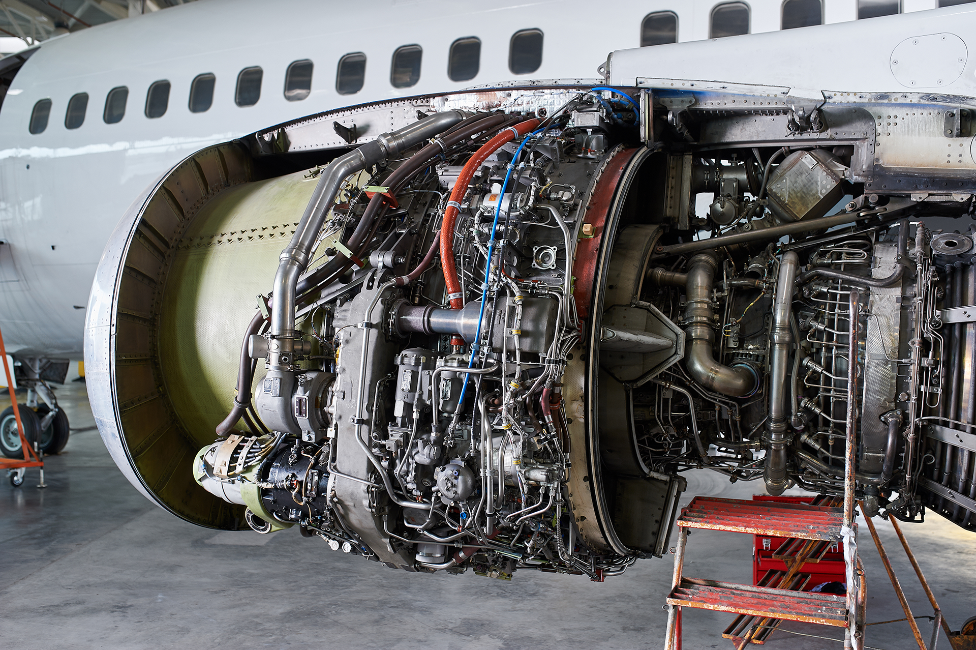 aircraft-engine-servicing-opened-panels-of-a-jetliner Aerospace components must meet exacting tolerances, withstand extreme temperatures and pressures, and perform flawlessly under challenging conditions. CNC (computer numerical control) machining enables manufacturers to meet these strict requirements with unparalleled precision and repeatability.
