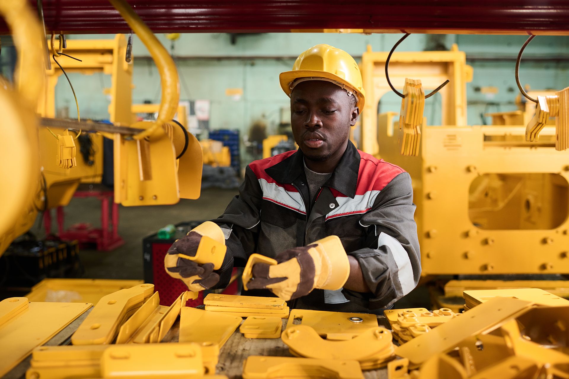 young-african-american-male-engineer-OEM-factory With advanced CNC machining capabilities, decades of manufacturing experience, and a commitment to American-made quality, Basin Precision Machining supports leading construction OEMs and industrial manufacturers across the Midwest.